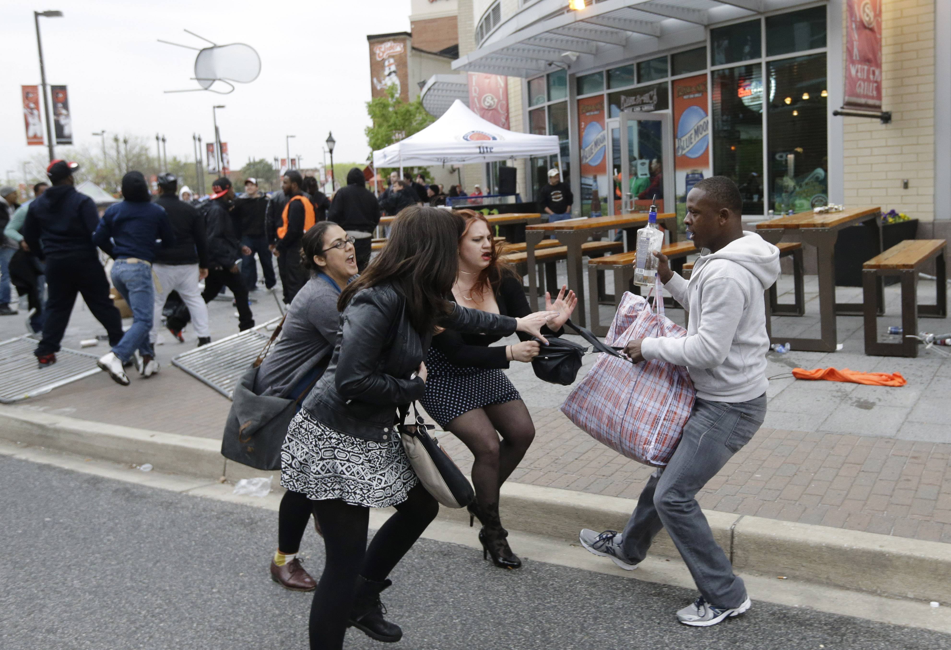 Is this a White woman stealing a purse from a noble Black non-violent prote...