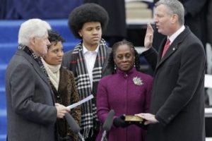 What a farce: Bill Clinton administers a meaningless oath of office to de Blasio.