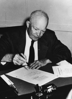 Eisenhower signs the "Civil Rights Act of 1957," which began the racial destruction of the United States, and which enabled him to "integrate" American schools at gunpoint later that year.