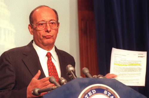 WASHINGTON, DC - JANUARY 5: US Senator Alfonse D'Amato, R-NY, chairman of the Senate committee investigating Whitewater, holds a copy of a memo turned over to the committee by the White House as he speaks to reporters during a press conference on Capitol Hill in Washington, DC, 05 January. The memo written by White House aide David Watkins contradicts US First Lady Hillary Clinton's contention that she played no role in the firings of the White House travel office employees. (Photo credit should read PAM PRICE/AFP/Getty Images)