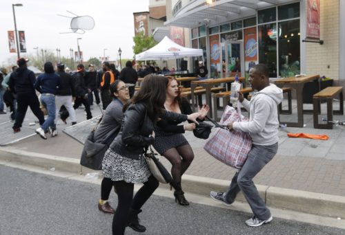 Is this a White woman stealing a purse from a noble Black non-violent protester?