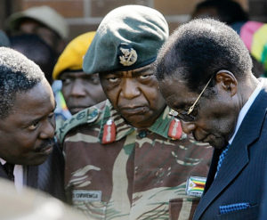 Zimbabwe's Robert Mugabe, right, in conference with fellow statesmen