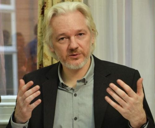 WikiLeaks founder Julian Assange gestures during a news conference at the Ecuadorian embassy in central London