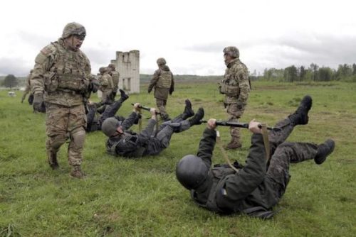 Servicemen of the U.S. Army's 173rd Airborne Brigade Combat Team train members of the Ukrainian National Guard during a joint military exercise near Starychy