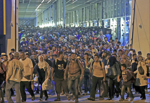Nonwhite invaders pour into Greece from ships facilitated and paid for by the EU.