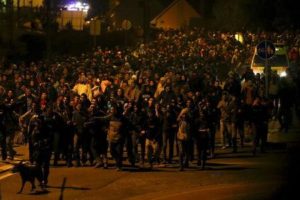 Migrants walk towards the Austrian border after arriving by train in the Slovenian village of Sentilj