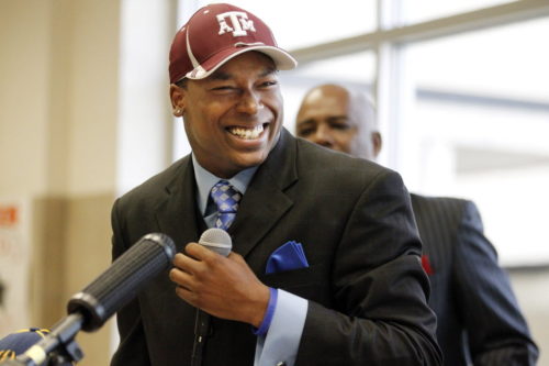 "Mr. Johnson": Skyline High wide receiver Thomas Johnson flashes a big smile, after he signed his National Letter of Intent to play college football for Texas A&M University in 2012