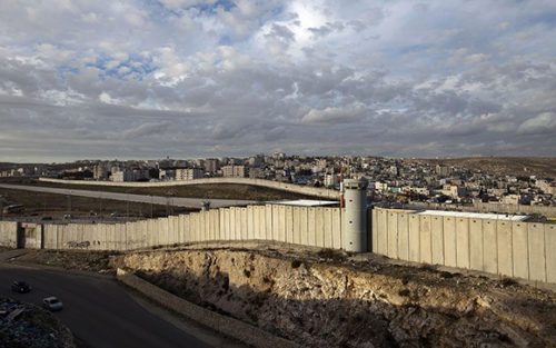 A general view shows a section of Israel's controversial separation barrier in the West Bank village of Al-Ram on the outskirts of Jerusalem on December 7, 2012. AFP PHOTO/AHMAD GHARABLI (Photo credit should read AHMAD GHARABLI/AFP/Getty Images)