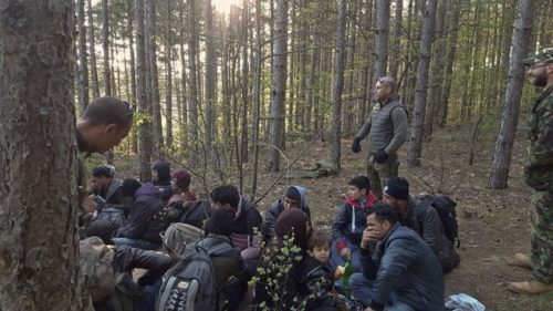 Members of the Organization for Protection of Bulgarian Citizens in April leading a group of migrants from Afghanistan near Bulgarian border with Turkey.