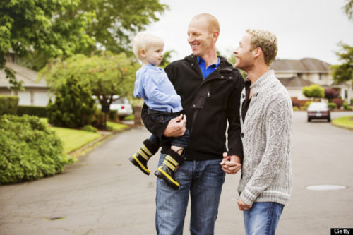Not a family. Queer couple with adopted blond boy.
