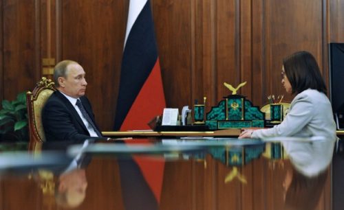 Russia's President Vladimir Putin (L) speaks with the Central Bank Governor Elvira Nabiullina during their meeting at the Kremlin in Moscow on August 10, 2015. Russia's central bank chief insisted today that the country's beleaguered banking system is out of danger after being battered by the economic crisis rocking the country. Russia entered its worst financial crisis of Putin's 15-year rule in December as plummeting oil prices and Western sanctions over the conflict in Ukraine sent the economy into a nosedive. 