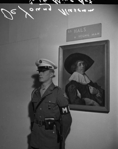 A U.S Military Policeman makes certain that this American looted painting by German artist Franz Hals was not going to be stolen.
