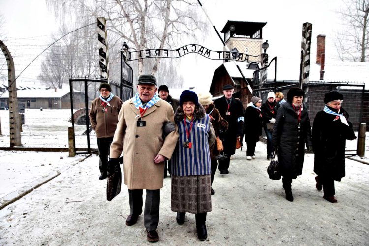 Holocaust survivors arrive for a ceremony to mark the 69th anniv