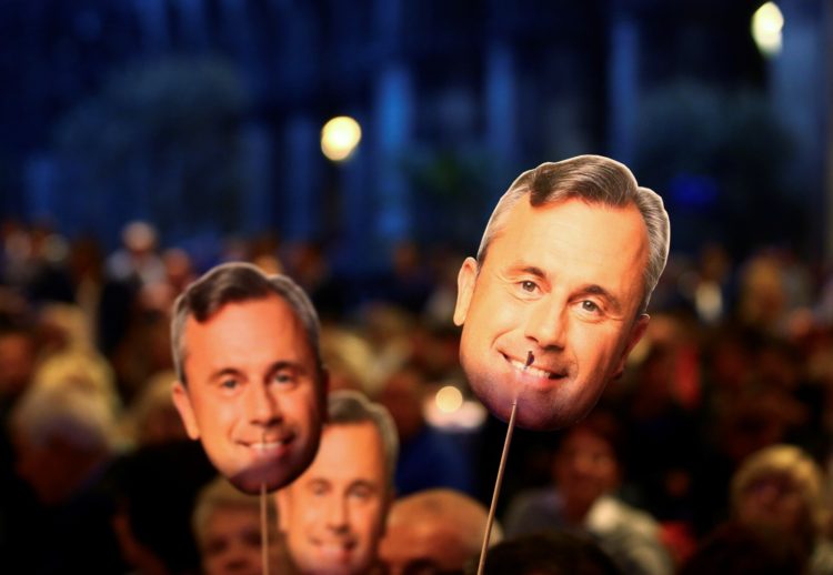 Supporters of Austrian far-right Freedom Party presidential candidate Norbert Hofer hold masks with Hofer's face during a September rally in Vienna.